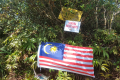 Gunung Besar Hantu - flag and signs at the summit (Dan Quinn, August 2024)