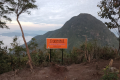 At the summit of Gunung Kerunai, looking to Kenderong (Dan Quinn, July 2024)